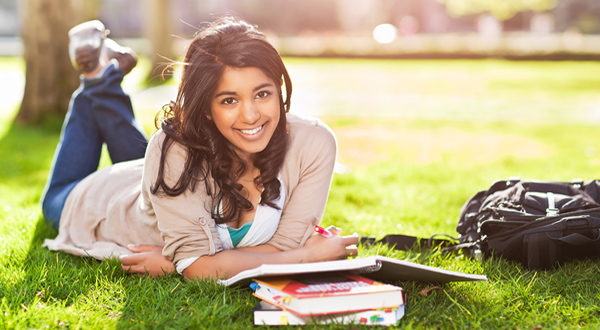 indian_american_studying_on_lawn